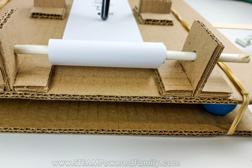 Close up of paper roll assembly and shake table base