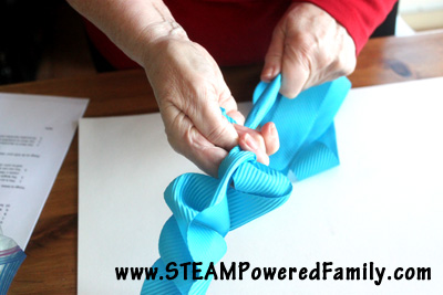 Ribbon flowers are a simple but stunning craft that can be used to add a beautiful touch to gifts, clothing, decor items and more. Simple enough for even young children to create, this is a fantastic activity with results that have the WOW factor! What a fantastic idea for customizing dresses for a wedding!