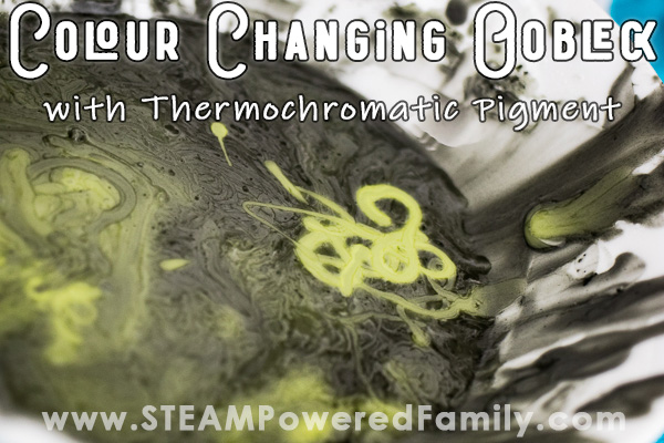 A bowl of black and yellow colour changing oobleck shows the yellow oobleck forming swirls.