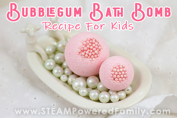 Pink bath bombs sit in a small antique bath tub with overlay text saying Bubble Gum Bath Bombs Recipe For Kids